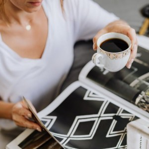 Photograph of woman leafing through a design magazine