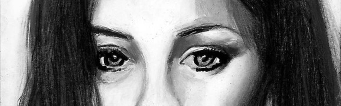 Emotional Realism in Art. Charcoal portrait of a sad, beautiful young woman on the verge of tears.