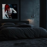 Soft Cubism painting hanging above bed in a darkened bedroom