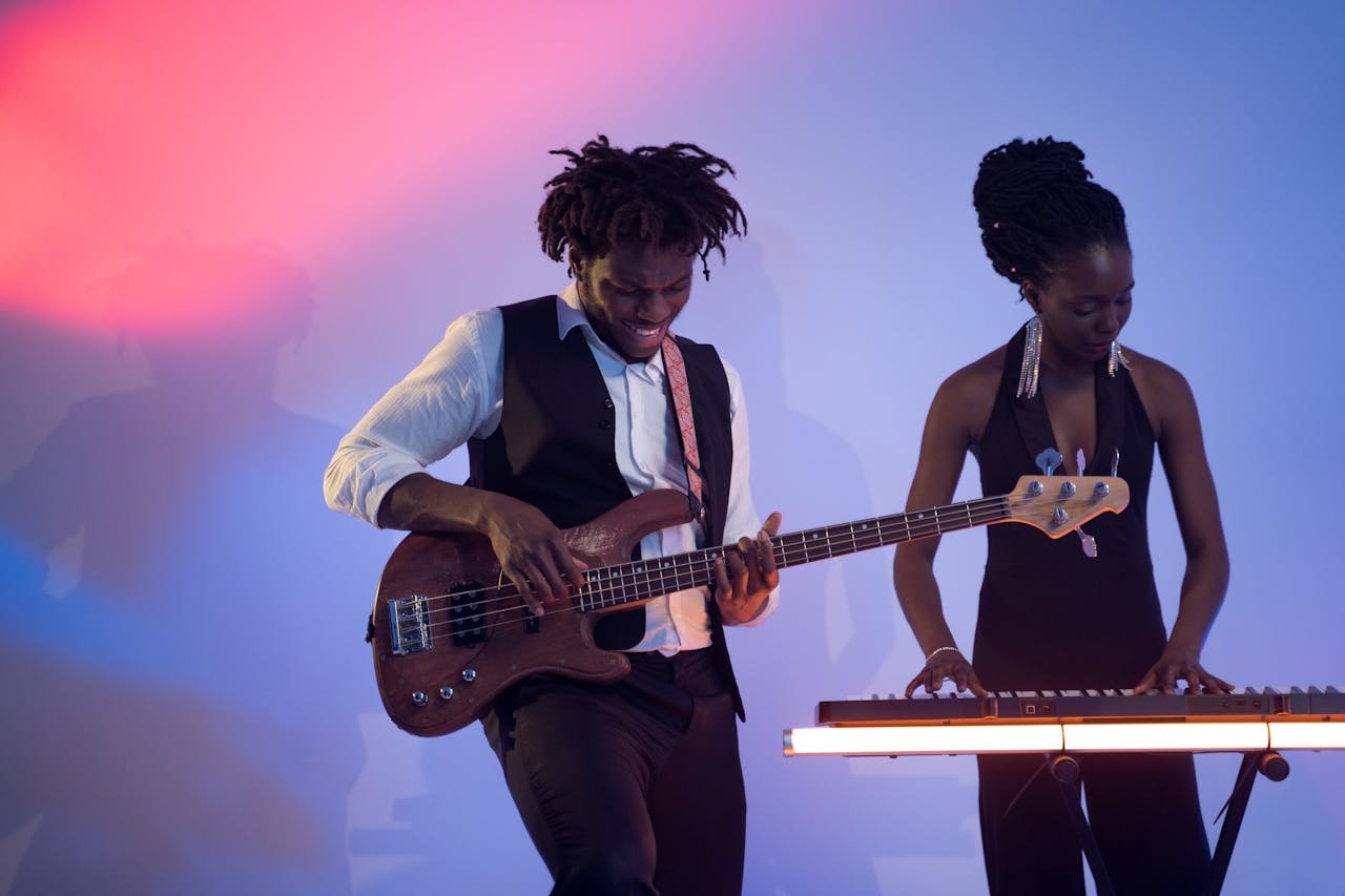 Male and female performers play in an RnB band