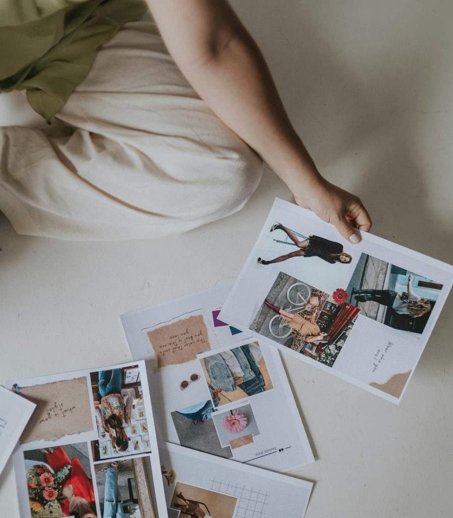 photograph of young woman sitting on floor, choosing design themes
