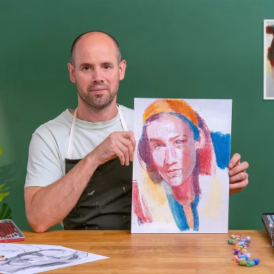 Artist Chris Gambrell holds one of his pastel portraits of a young woman