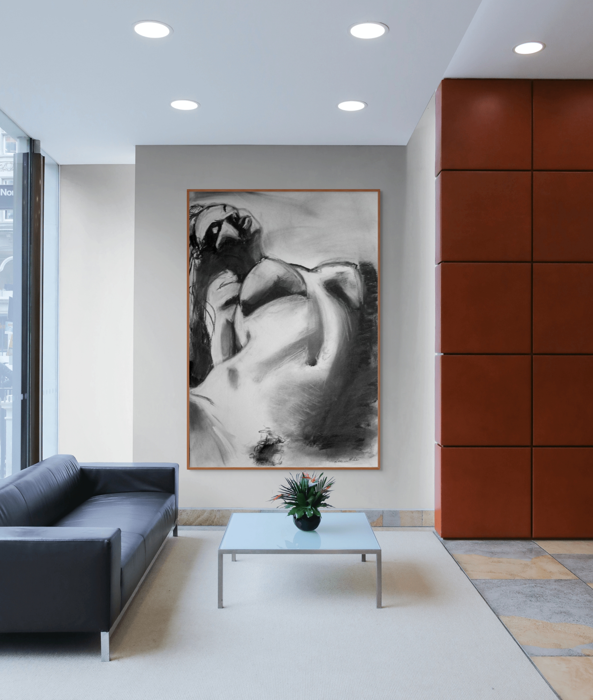 Large monochrome charcoal portrait titled “Just Be Good to Me” displayed above a minimalist black sofa in a modern interior — expressive figurative art for contemporary spaces.