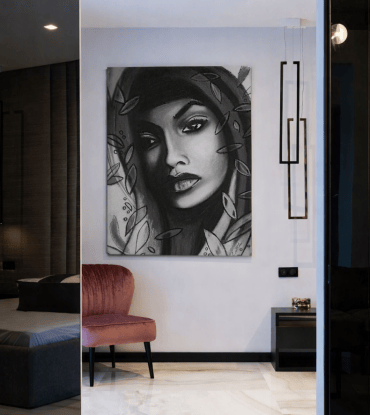 Large monochrome portrait titled “Gita” displayed unframed on a penthouse wall with marble flooring and minimalist lighting — an example of Penthouse Wall Art Ideas for High Ceilings.